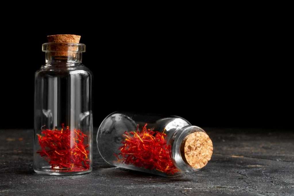 How to Store saffron like a pro? Two small vials of saffron with cork stoppers.